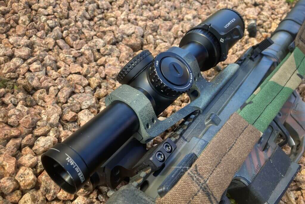 Vortex Viper 1-6 scope mounted to rifle on small rocks