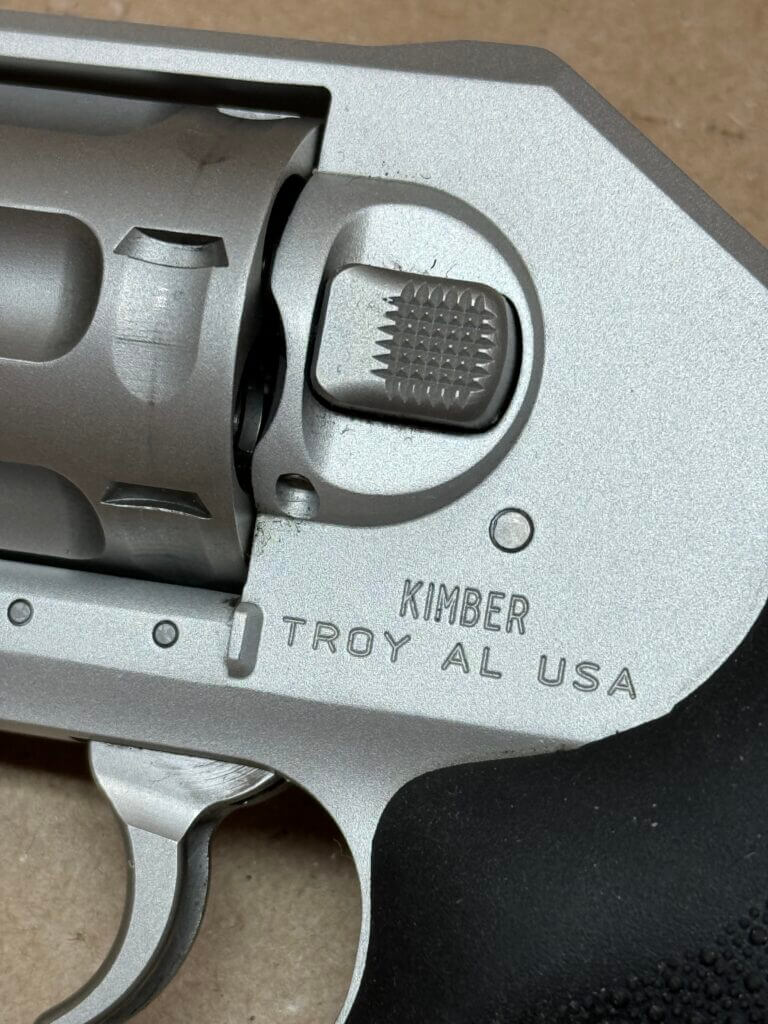 Kimber K6xs cylinder release button and brand name engraved into metal