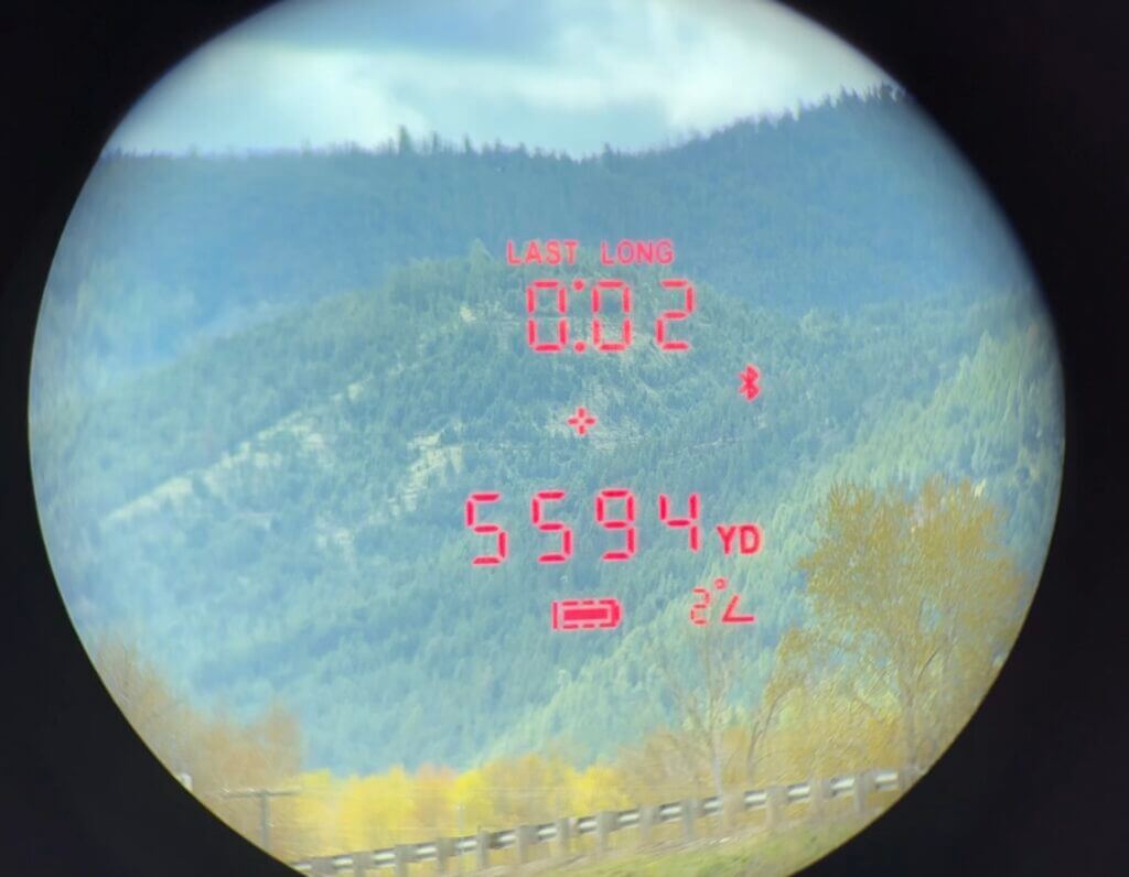 A rangefinder display shows a hill that is 5600 yards away.