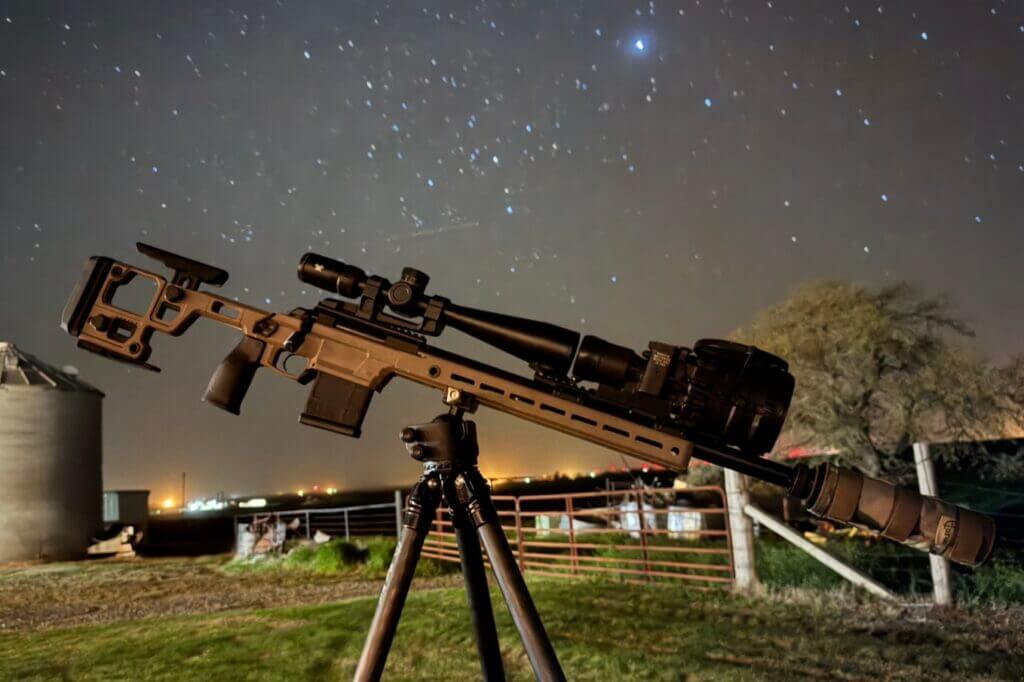 The Vortex Viper HD 5-25 scope mounted to an Aero Precision SOLUS rifle in front of a starry night sky