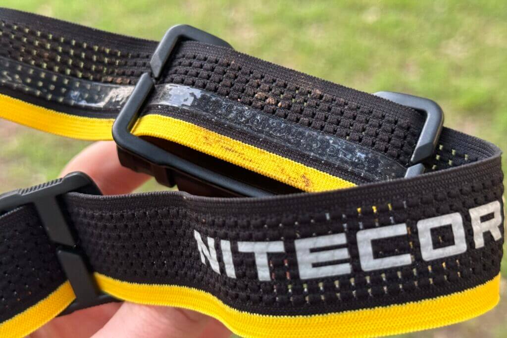 Black and yellow strap of the Nitecore HC65 UHE headlamp