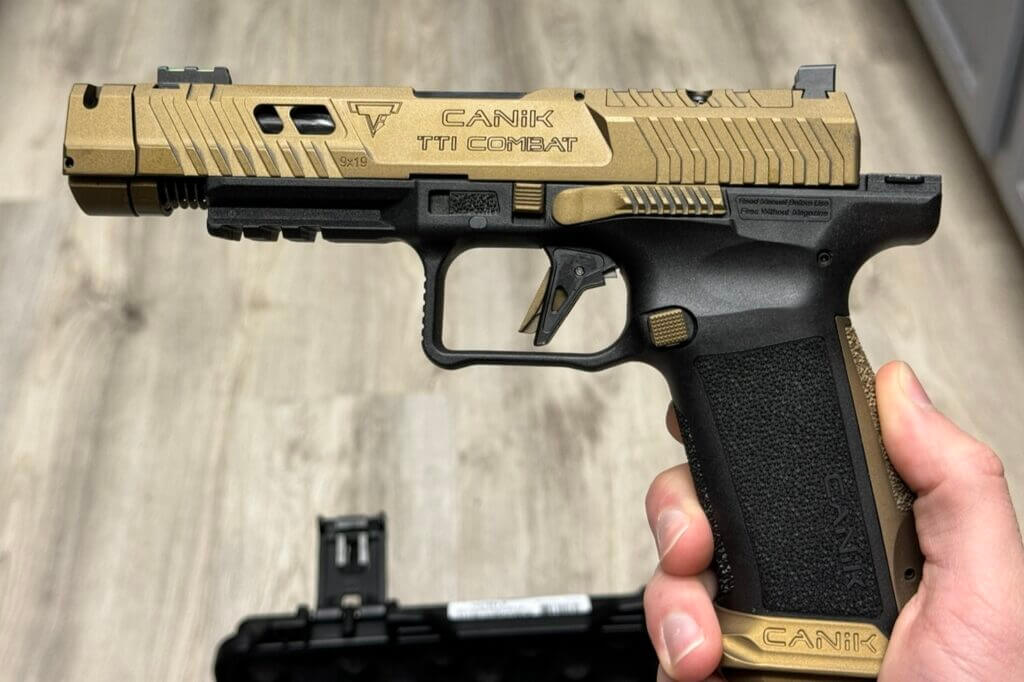 A CANiK handgun in a person's hand