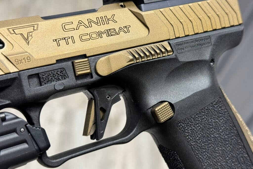 Closeup on the engraving of a CANiK TTI Combat pistol