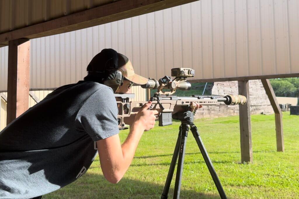 man shooting Solus rifle at range