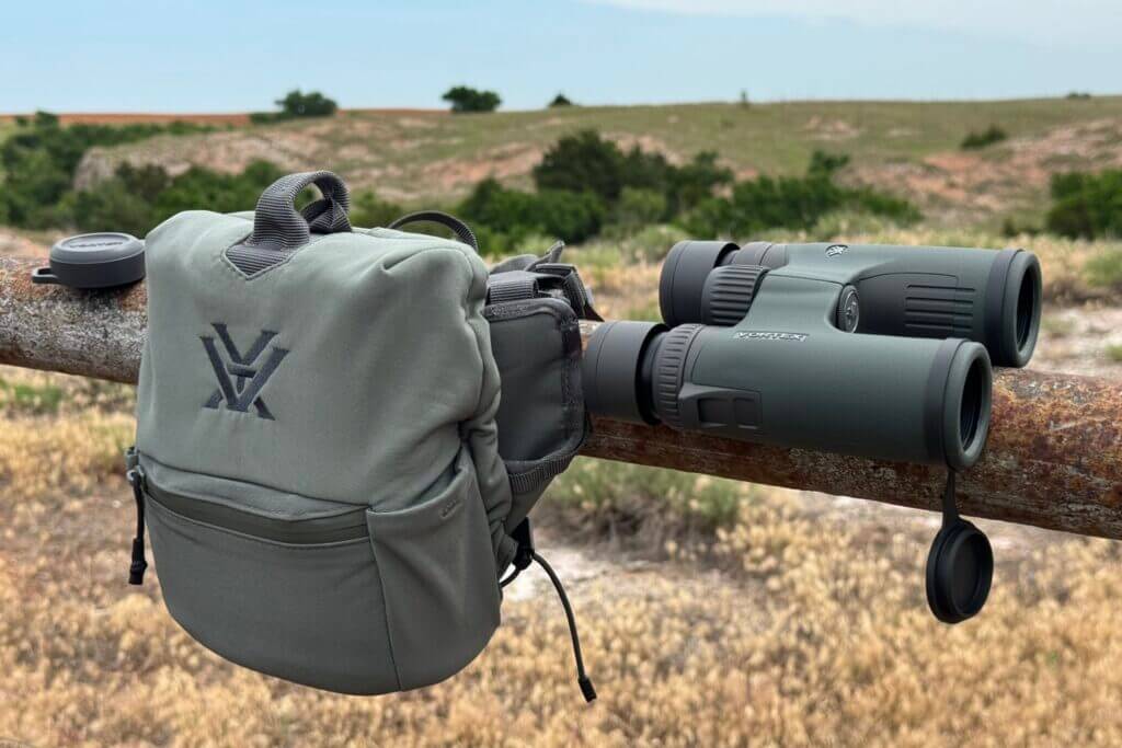 Vortex Razor UHD binoculars with range bag on steel fence 