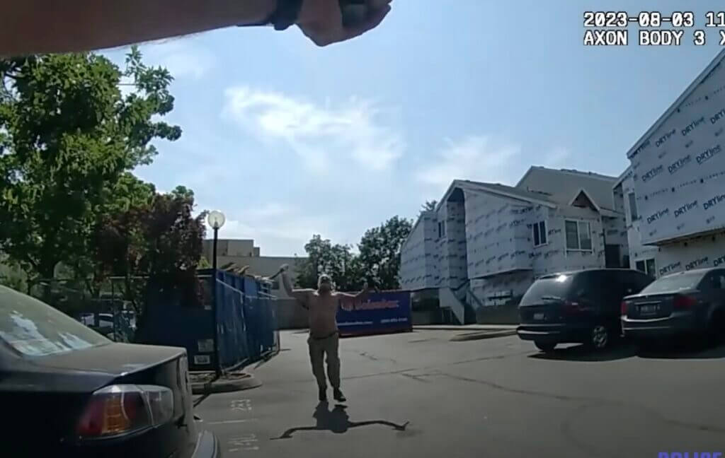 Man on meth charging police with a hammer and a long, fixed-blade knife.