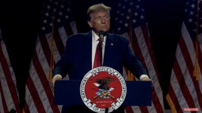 Trump at the podium at the 2024 NRAAM.