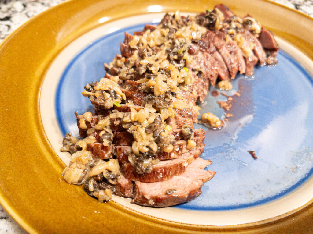 Bear backstrap smothered in sauted morel mushrooms and shallots