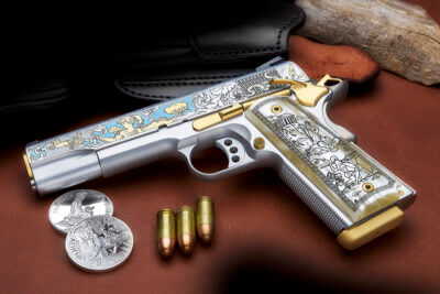 A 1911 pistol with three bullets and two coins.