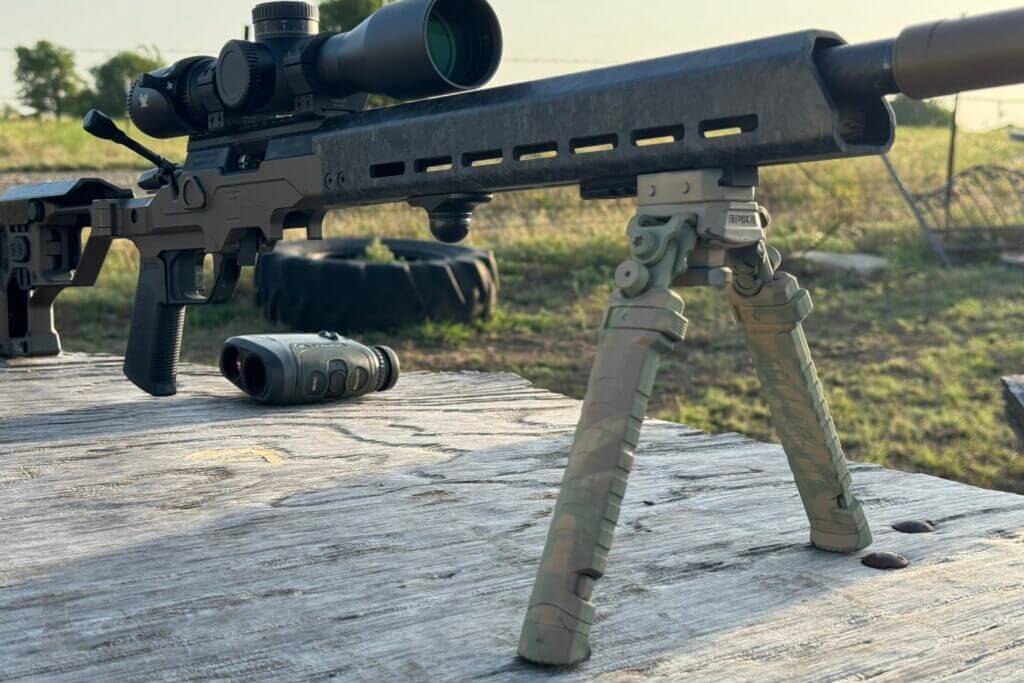 Christensen Arms MPR Rimfire on wooden table with scope and small bipod