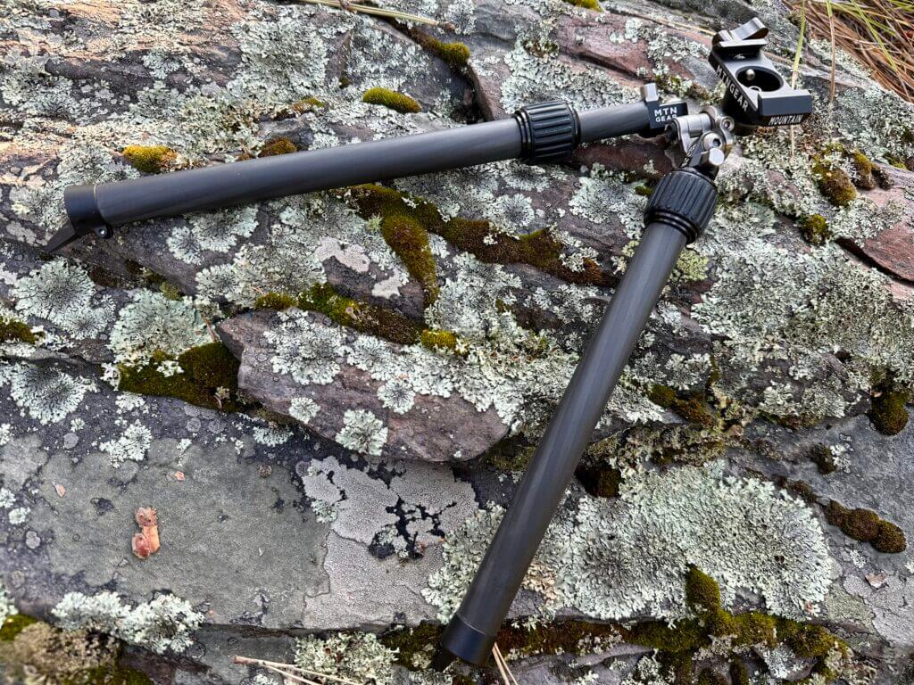 MTNGear Mountain Bipod lays on a rock background.