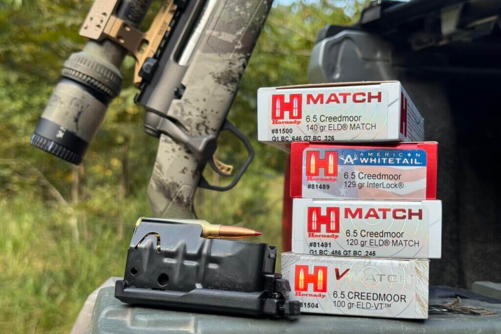 Savage AXIS 2 Pro on truck tailgate with magazine and Hornady Match ammo