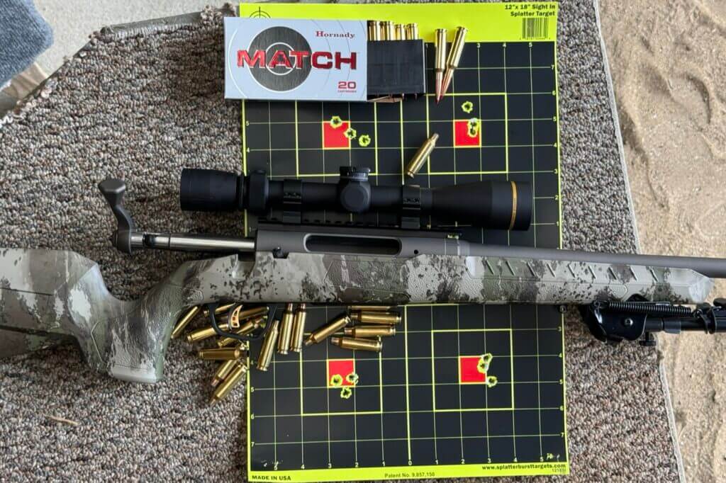 Savage AXIS 2 Pro on neon target with Hornady ammo