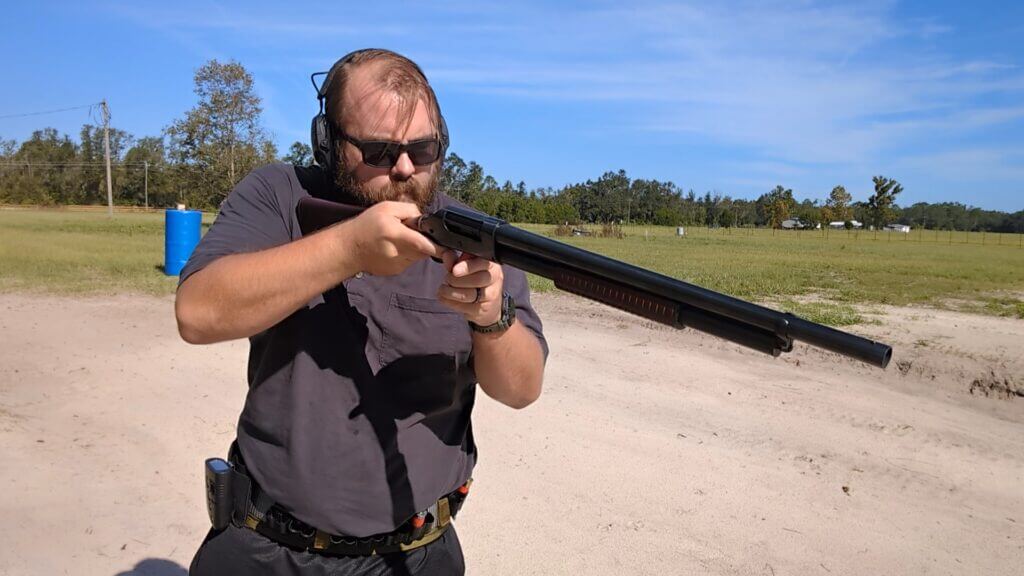 Man shooting gun at range