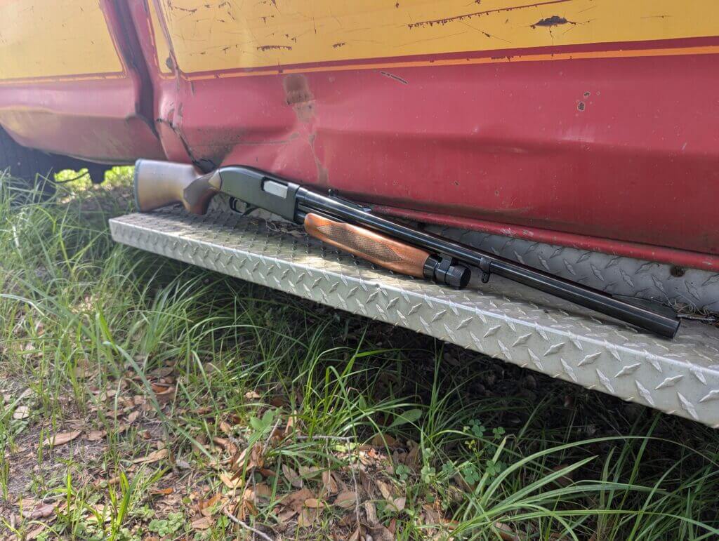 Winchester Model 1300 near vintage red and yellow truck