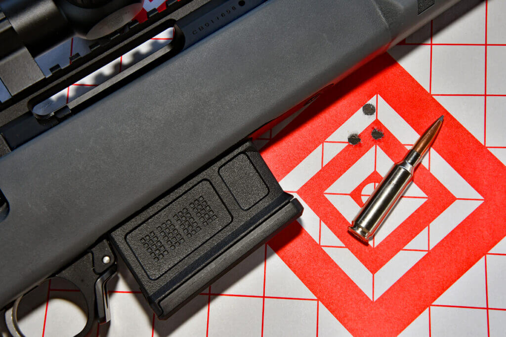 Colt CBX TAC Hunter rifle with Magpul AICS-style magazine and 6.5 Creedmoor ammunition and target