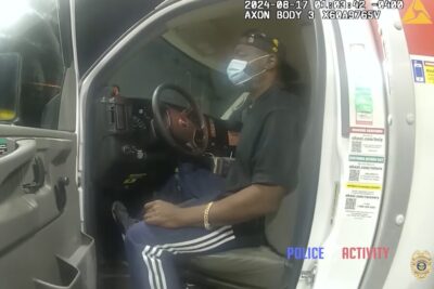 The suspect sits in the driver's seat of the U-Haul.