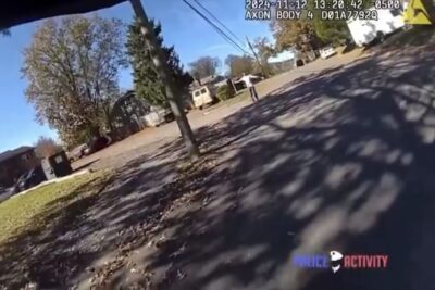 A screenshot of bodycam footage as a Knoxville police officer shoots an axe-wielding suspect.