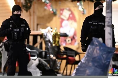 Two police officer stand guard following the attack in Germany.