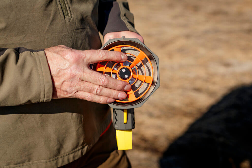 ClayCopter Pigeon being loaded in a ClayCopter launcher