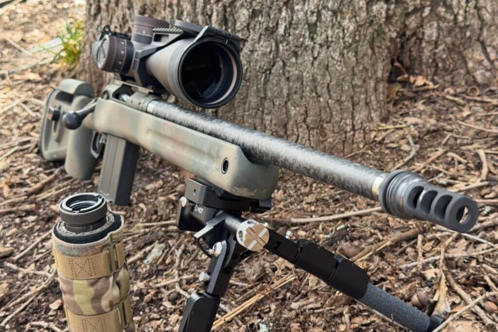 Savage 110 PPR on bark-strewn ground