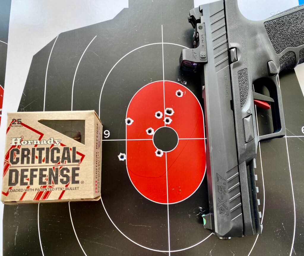 target with 9 bullet holes with Hornady Critical Defense ammo and PX-5.7 pistol