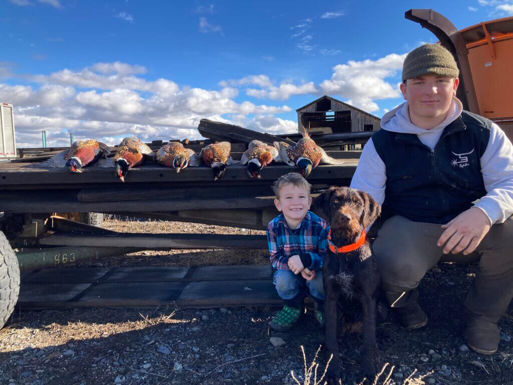 German Wirehaired Pointe and two boys