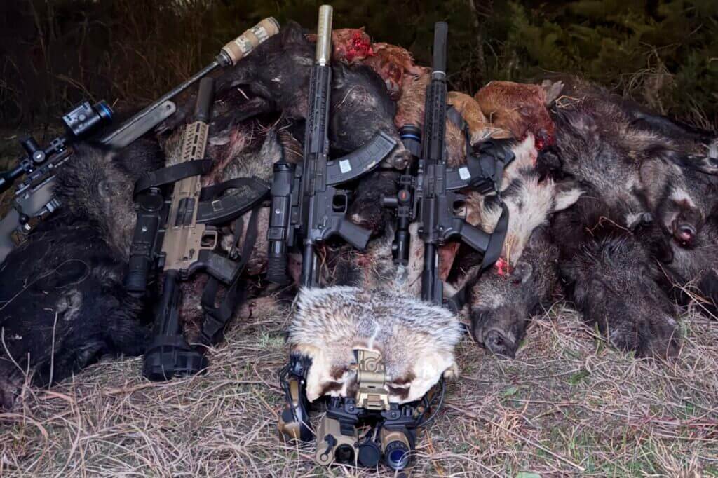 guns, dead animals, and night vision helmet
