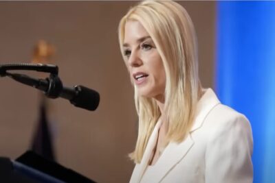 Pam Bondi at the podium.