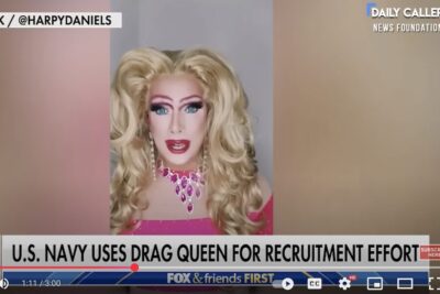 A drag queen touts military enrollment under the Biden administration.