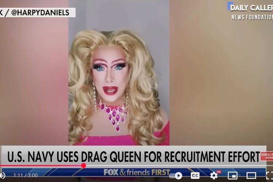 A drag queen touts military enrollment under the Biden administration.