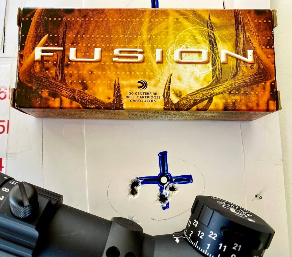 5 shot group on a target with fusion ammo nearby