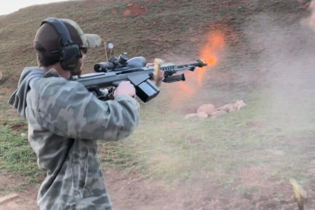 man shooting a rifle at a hill Father’s Day shooters