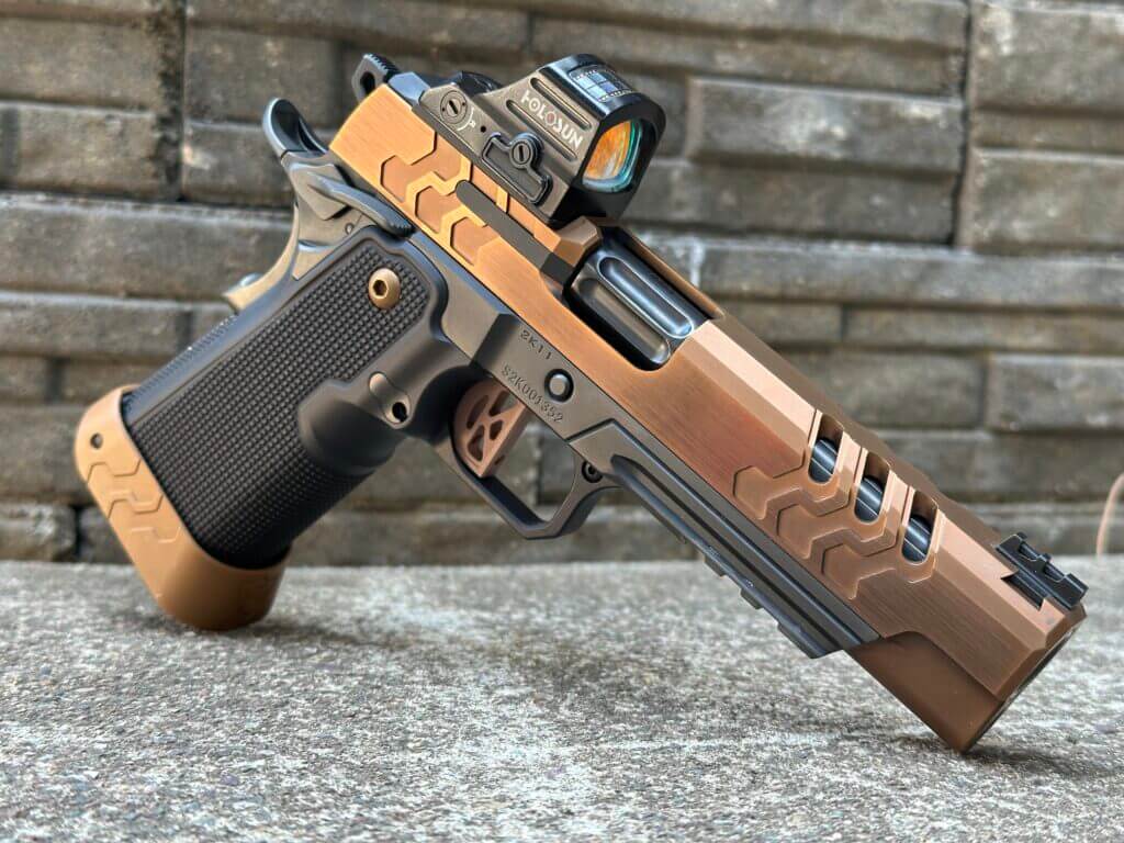 Bronze and black two-tone 2011 posed on a cement and stone background.