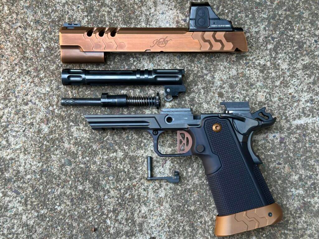 A 2011 pistol is disassembled on a concrete pad. 2K11 Target (OR)