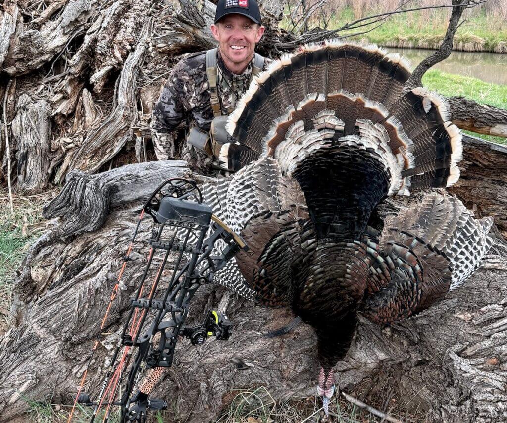 man with a dead turkey