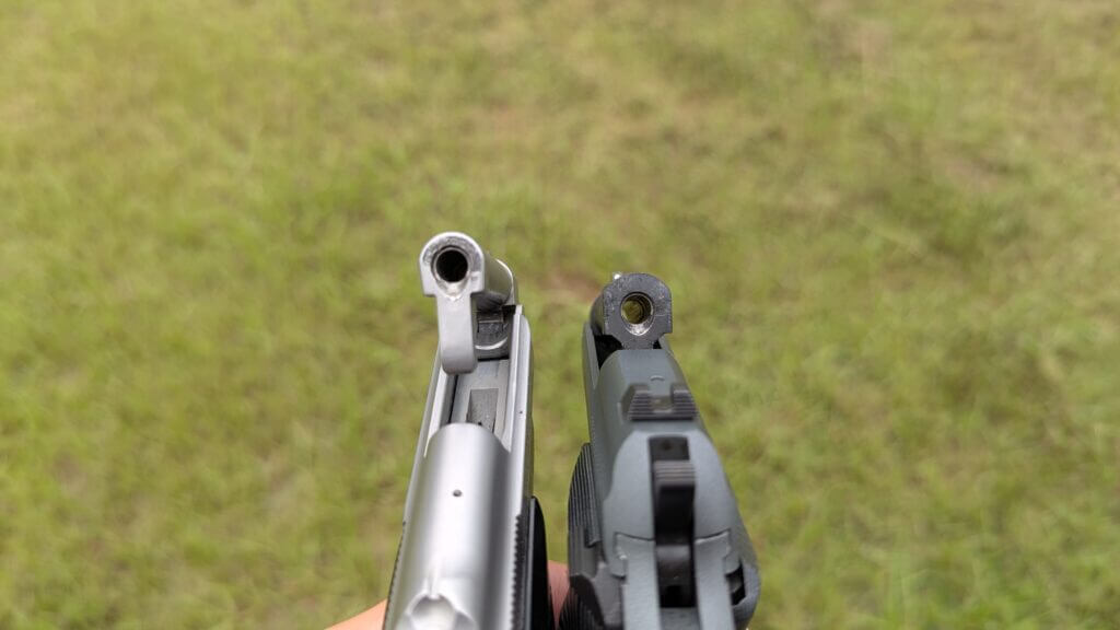 Beretta 20X and 21A with barrels tipped up showing chamber access