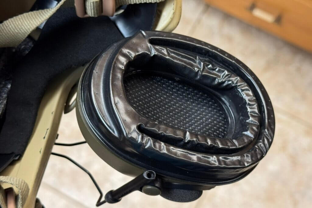 ComTac VIII mounted on helmet ARC rails during night hunt showing secure fit with NV setup