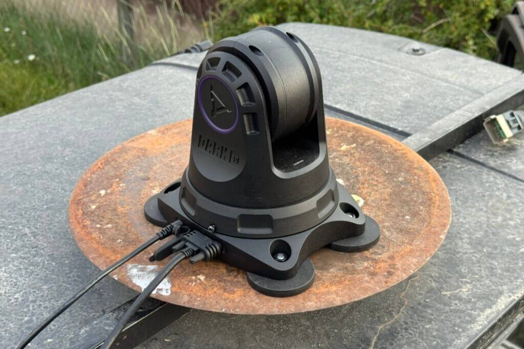 Power and HDMI ports on left side of Dark 30 Defiance PTZ base with cables routed into cab