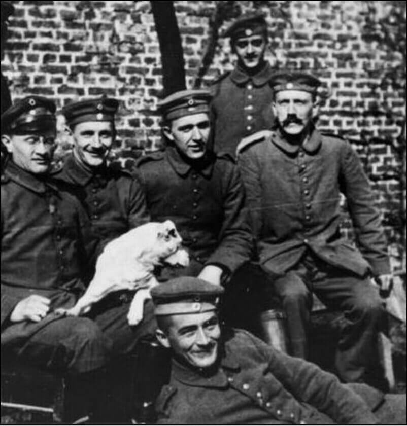 Adolf Hitler seated with his dog Fuchsl during WW1, period photograph