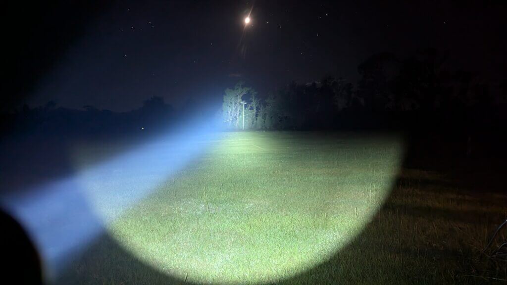 Rifle with high candela light producing tight focused beam at night