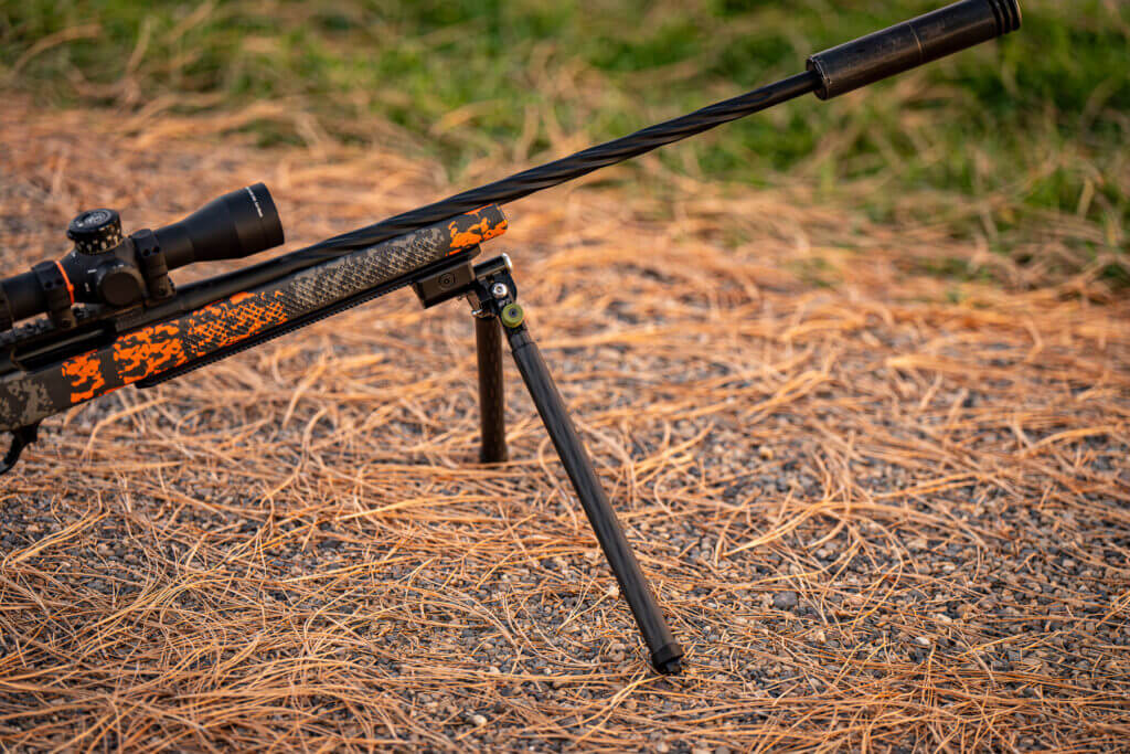 Rifle on ground with CKYE-POD Hybrid using R3D carbon legs for extended height