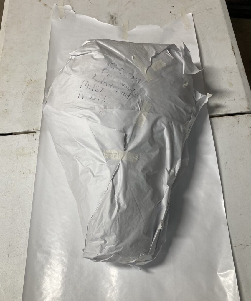 Whole rear elk quarter wrapped in plastic before butcher paper for Traeger cook