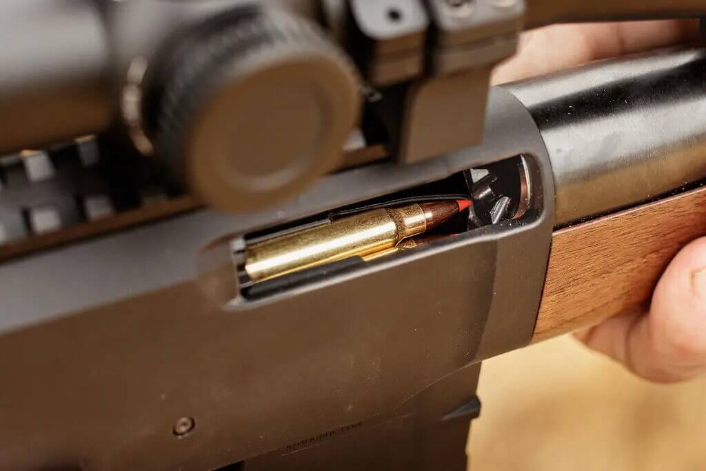 223 cartridge feeding from AR-15 magazine in the Henry Lever Action Supreme ejection port