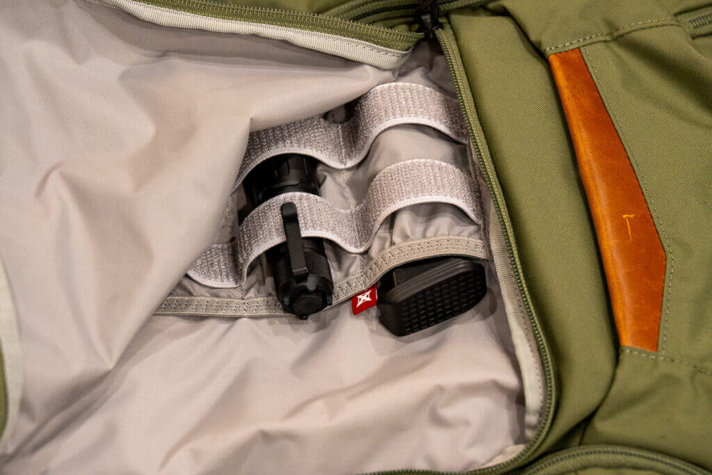 Vertx Gamut 32L interior organizer with mesh pockets, elastic loops, and slots