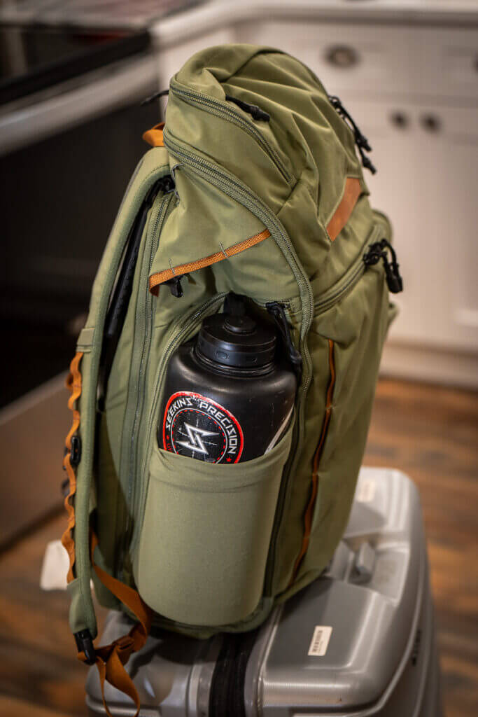 Vertx Gamut 32L side pocket and zipper detail close-up