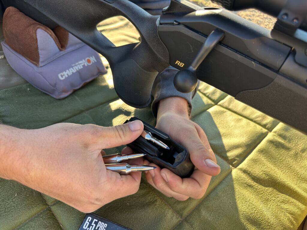 Loading cartridges into Blaser R8 detachable magazine during range session