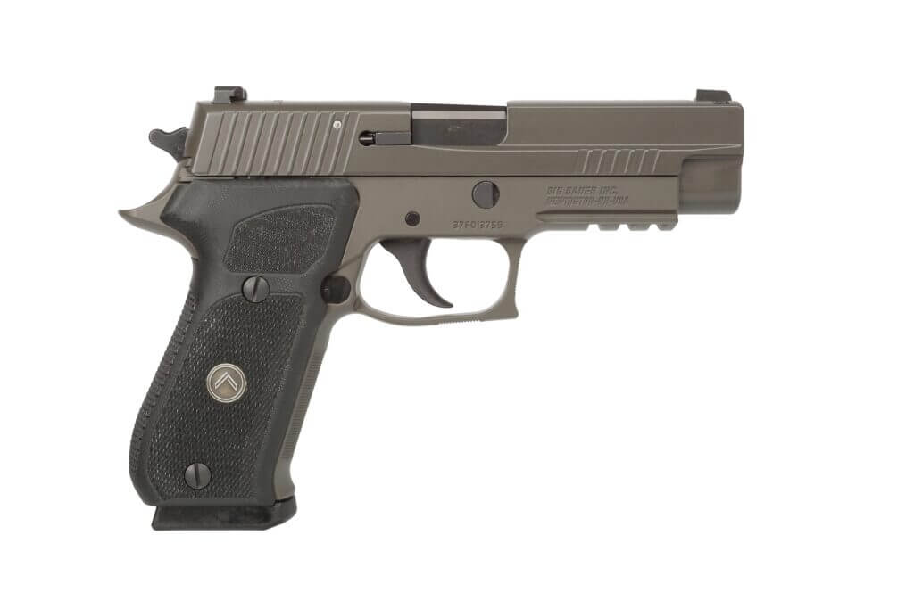 Side view of SIG Sauer P220 .45 ACP pistol with serrated slide and ergonomic grip