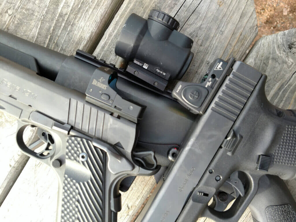 multiple red dot sights on handgun shotgun and rifle examples