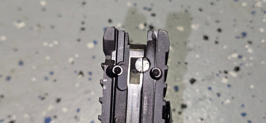 Bottom of Sig P211 GTO showing series 80 style safety plunger and Sig-Loc optic mounting footprint